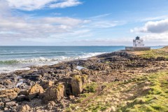 Budle Bay, reflections, Blackrocks Point lighthouse